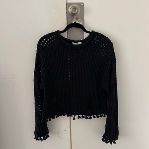 Black open knit sweater with tassels